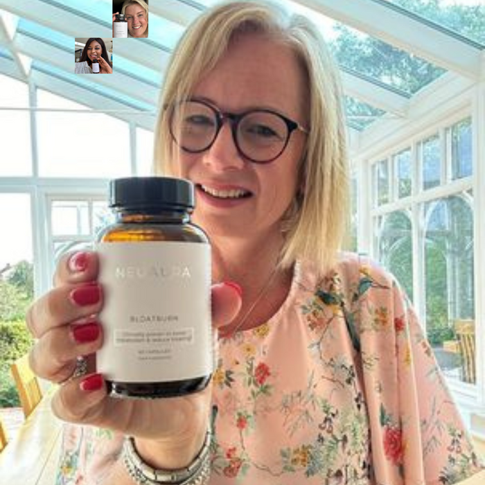 A person smiling and holding a bottle labeled 'Metabolic+' in a bright, well-lit room.